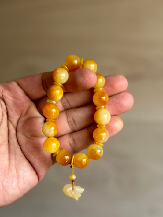 Burma Golden Imperial Jadeite Stretch Bracelet, 10mm Beads,
Length is 6”