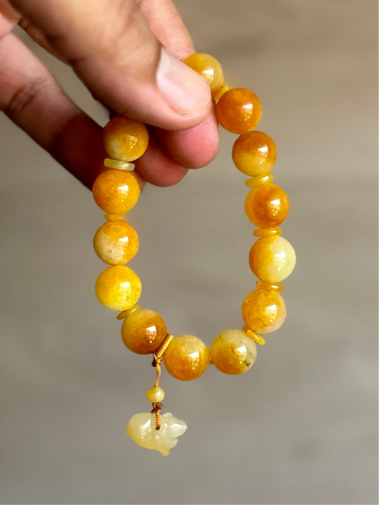 Burma Golden Imperial Jadeite Stretch Bracelet, 10mm Beads,
Length is 6”