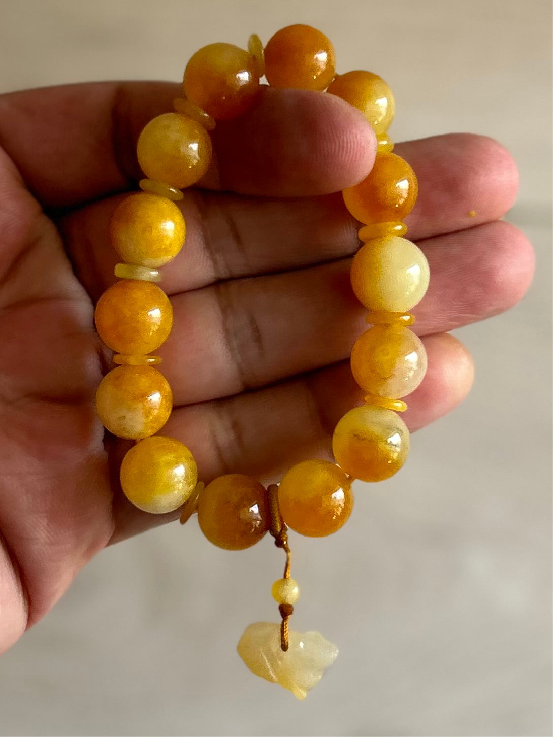 Burma Golden Imperial Jadeite Stretch Bracelet, 10mm Beads,
Length is 6”
